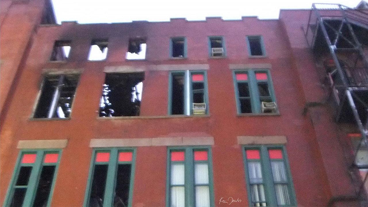 Brick Building with Red and Green Windows backdrop